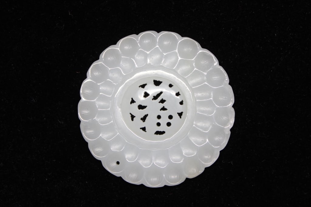Chinese Jade Carved Round Plaque: Chinese Jade Carved Round Plaque Dimension: 2"W . The center is intricately pierced with various geometric and foliate cutouts. This delicate technique, known as "exquisite openwork," was