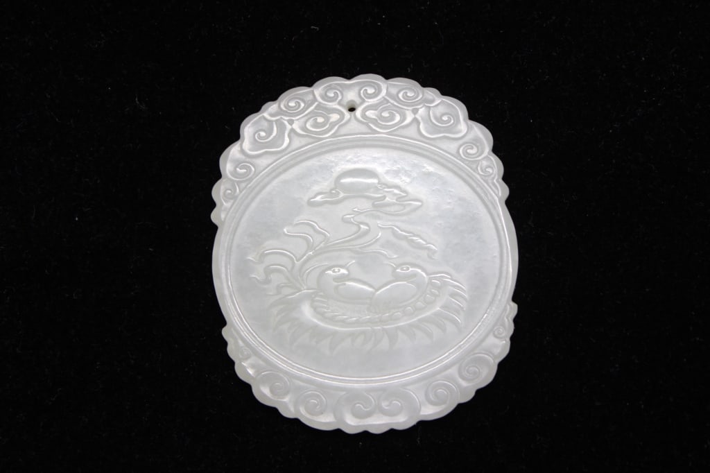 Chinese White Jade Carved Pendant Plaque: Dimension: 4.8cm x 5.5cm. A relief carving depicting a pair of birds (often identified as magpies or phoenixes) nestled together beneath a pine tree. In Chinese culture, magpies symbolize