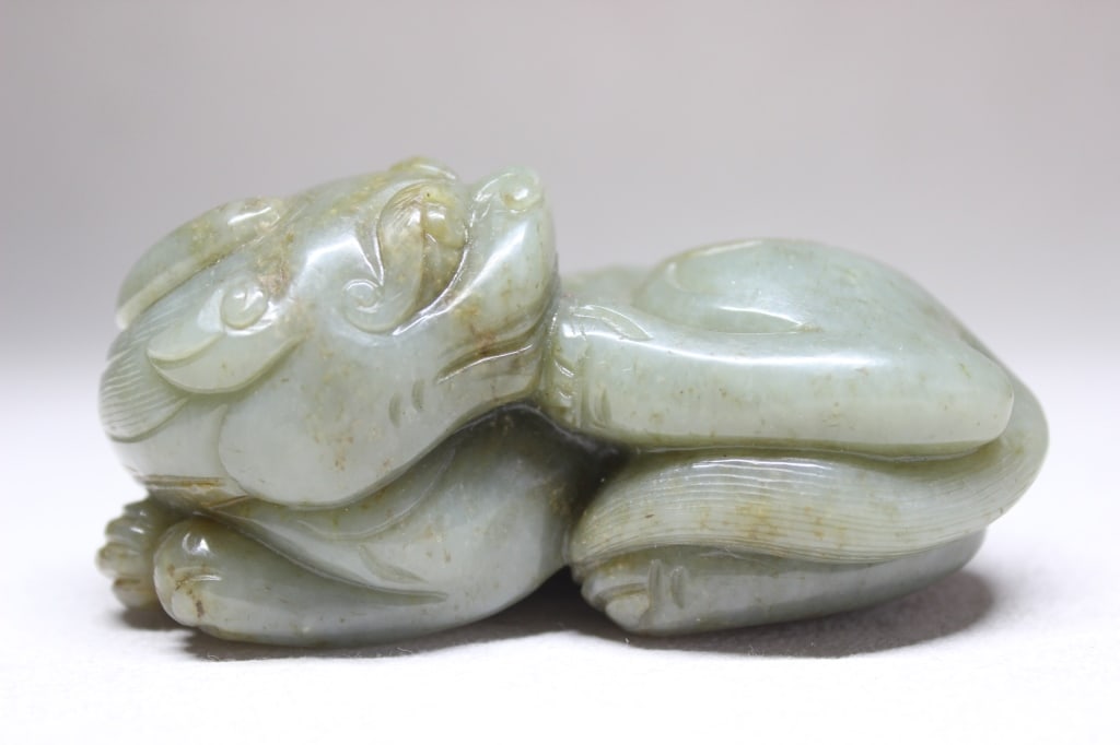 Chinese Jade Carved Recumbent Beast: Chinese Jade Carved Recumbent Beast Dimension: 9.5cm Long. A mythical dragon-like creature in Chinese culture believed to be a "fortune protector" that attracts wealth and wards off evil.
