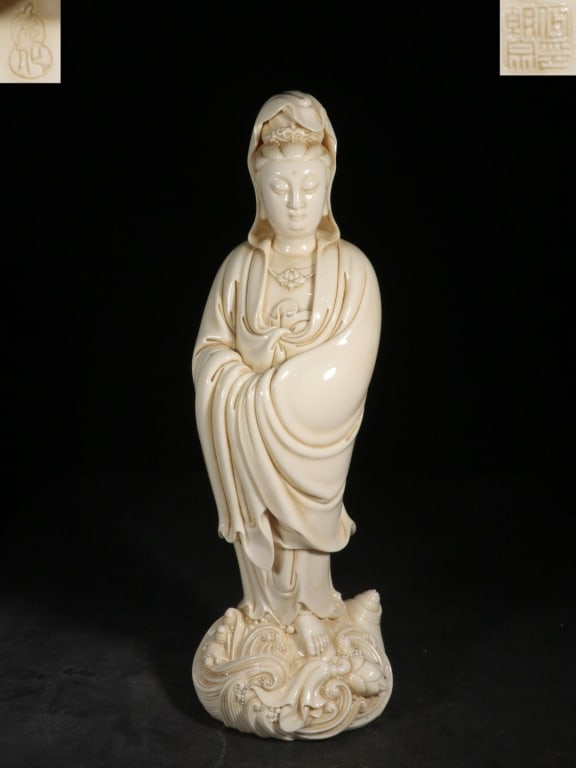 Chinese Blanc De Porcelain Guanyin Figure: Dimension: 47.5cm H x 15.6cm L x 13.5cm W. She wears a ruyi-head necklace and a crown, with her hands tucked gracefully into her voluminous sleeves—a posture of deep meditation and calm.The