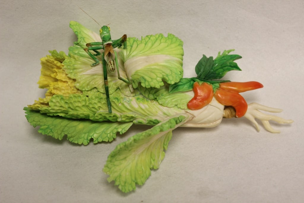 Antique Chinese Polychrome Bone Carving: Dimension: 7"x 8 1/2". The carving depicts a large, realistic cabbage (or bok choy) being explored by a cricket. In Chinese culture, the cabbage (bai cai) is a pun