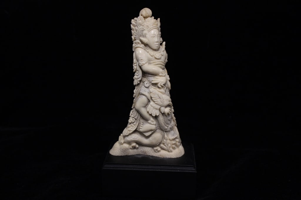 19th.C Balinese Carved Bone Figural Guardian: Dimension: 6 1/2"H . The carving typically represents a demonic guardian or Buta Nawasari, a powerful figure in Balinese Hindu mythology intended to protect the owner of the blade.