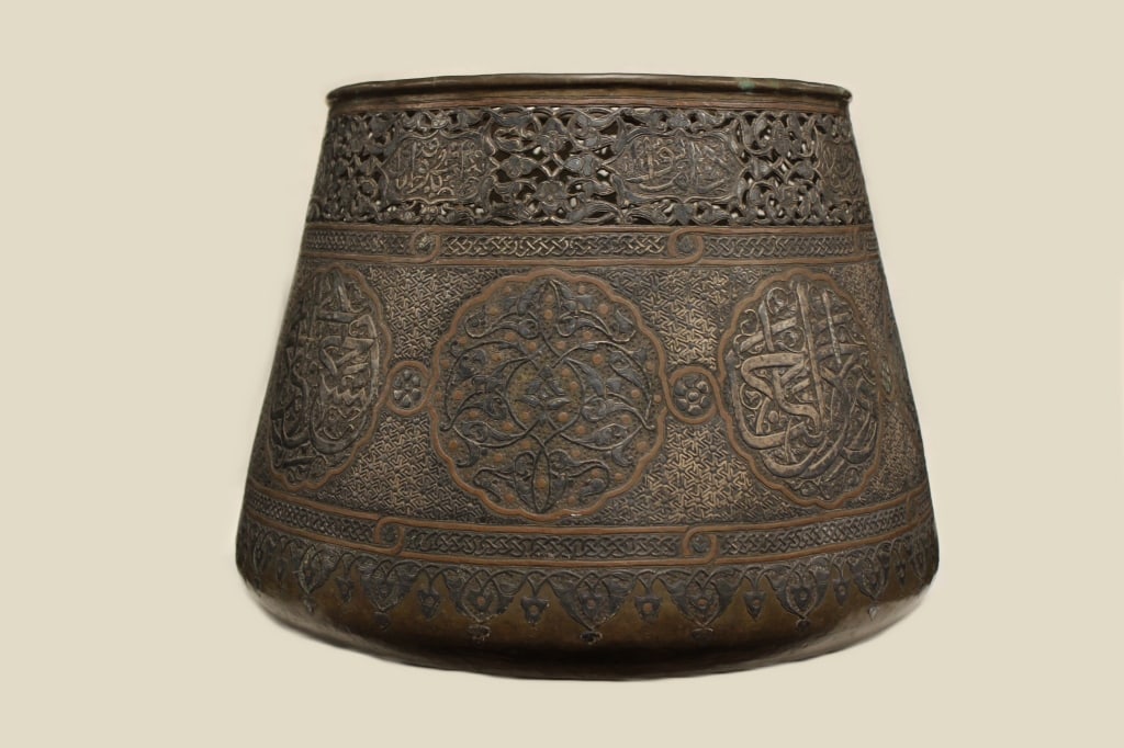 A 19th Century Middle Eastern Islamic Cairoware: Dimension: 12"H x 16"W These jardinieres are often profusely decorated with silver and copper inlay within brass or tinned-copper bodies.The circular cartouches typically contain Arabic