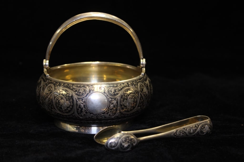 Antique Silver Sugar Bowl with Tongs: Antique Silver Sugar Bowl with Tongs Dimension:4 1/2"W. Decorative antique silver sugar bowl with tongs, likely late 19th to early 20th century, made in England.