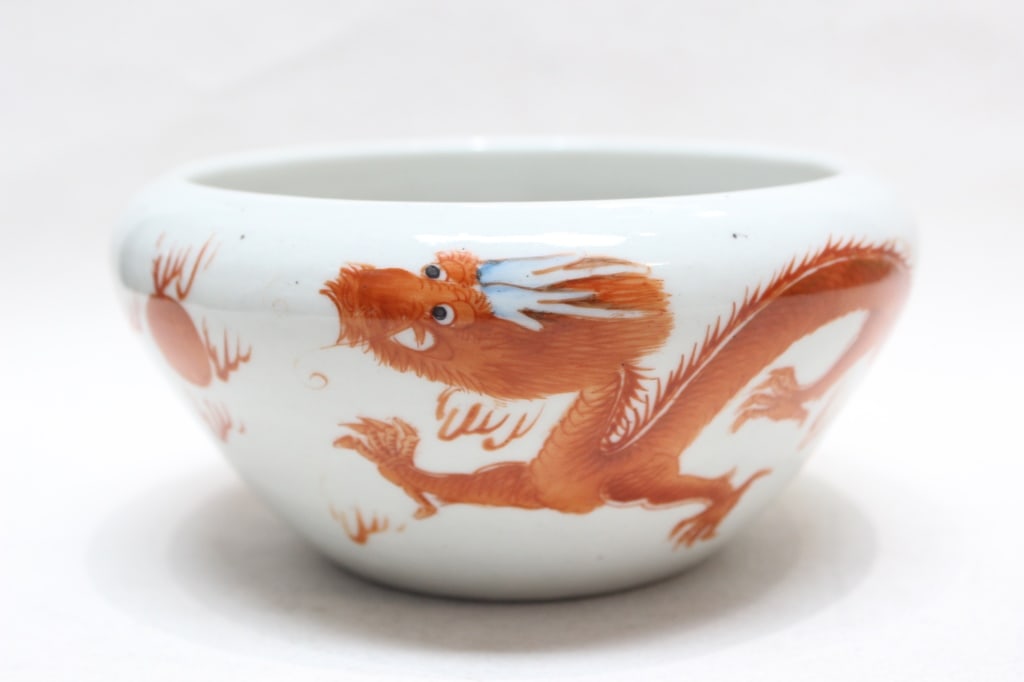 Chinese Iron-red Porcelain Washer: Dimension: 3"H x 6 1/2"W. Chinese iron-red porcelain bowl, characterized by its vibrant dragon motif. Bowls of this style were popular during the Qing Dynasty (1644–1911) and continued to be