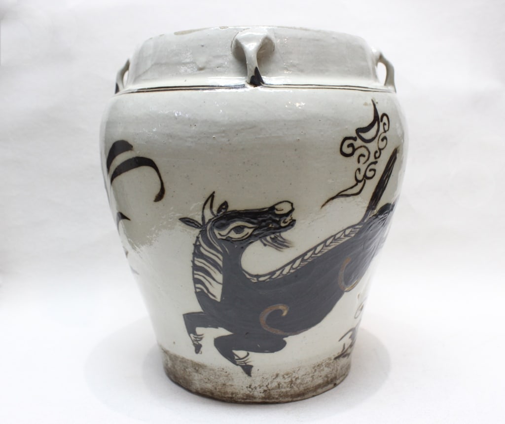Chinese Cizhou-style Porcelain Jar: Dimension: 8 1/2"H. The jar features a hand-painted animal.