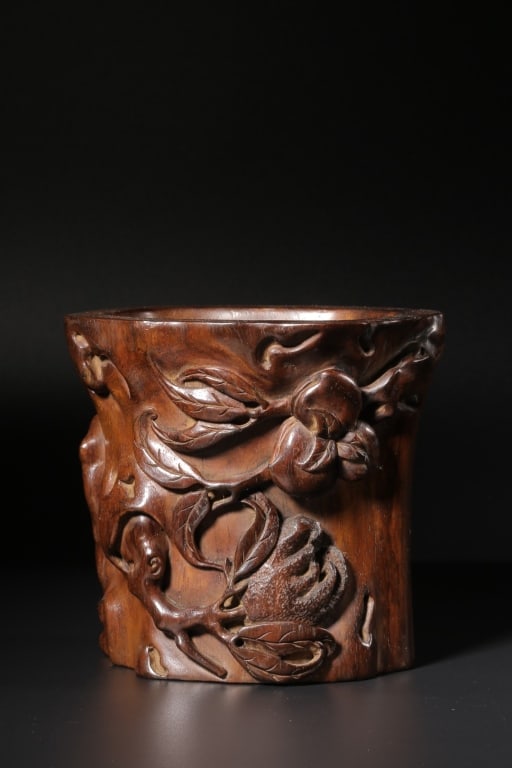 Chinese Carved Huanghuali Wood Brush pot: Dimension: 11.3cm H x 12cm L x 9cm W,weight is 309gram. The pot features high-relief carving of the "Three Abundances" (Sanduo), a popular auspicious motif in Chinese art.