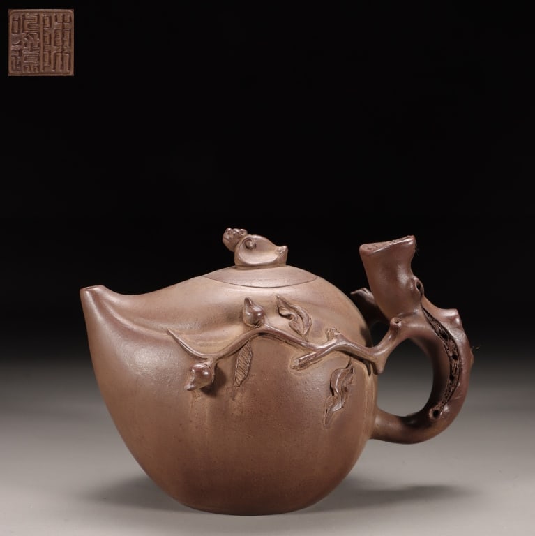 Chinese Yixing Zisha Clay Teapot,Mark: Dimension: 11cm H x 16cm L x 8.5cm W,weight is 333gram. designed in the form of a Longevity Peach (shoutao). Crafted from the famous "purple sand" clay of Yixing.