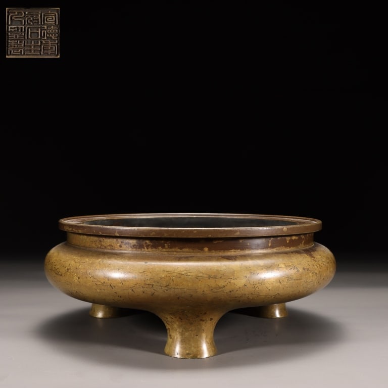 Chinese Bronze tripod Incense Burner: Dimension: 7cm H x 20cm,weight is 2250gram. A classic compressed globular body with a wide, flared rim and a short, waisted neck. It rests on three short, tapered conical feet (often called 