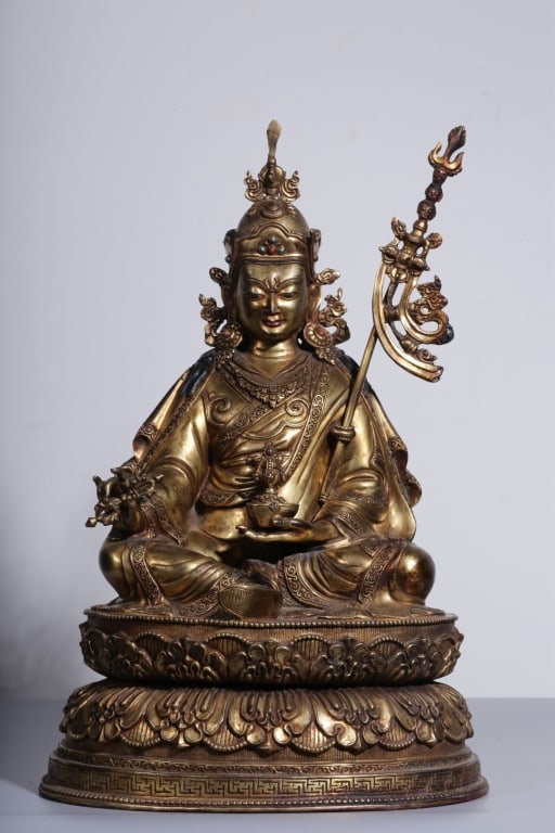 Tibetan gilt-bronze statue of Guru Padmasambhava: Tibetan gilt-bronze statue of Guru Padmasambhava. Dimension: 42cm H x 28x 23cm