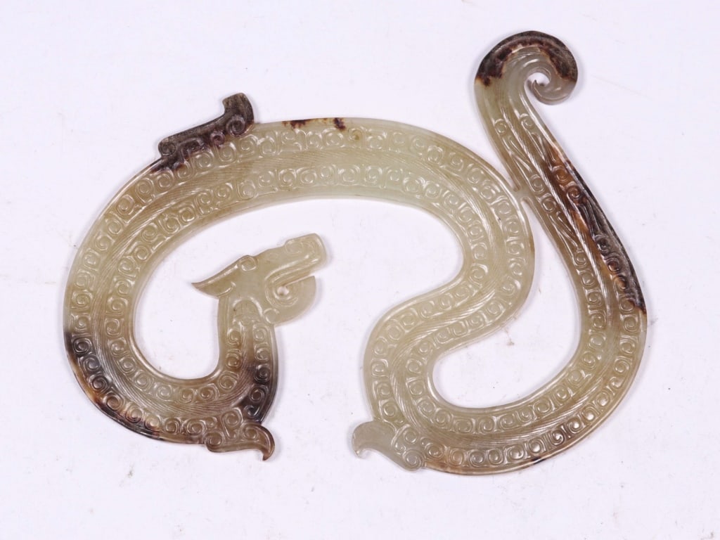 Chinese Ancient Jade Carved Dragon Pendant: Chinese Ancient Jade Carved Dragon Pendant.Dimension: 14cm L x 8.5cm x 0.5cm.The pendant features a flattened, "S" or arched dragon body. The surface is typically decorated with raised grain patterns 