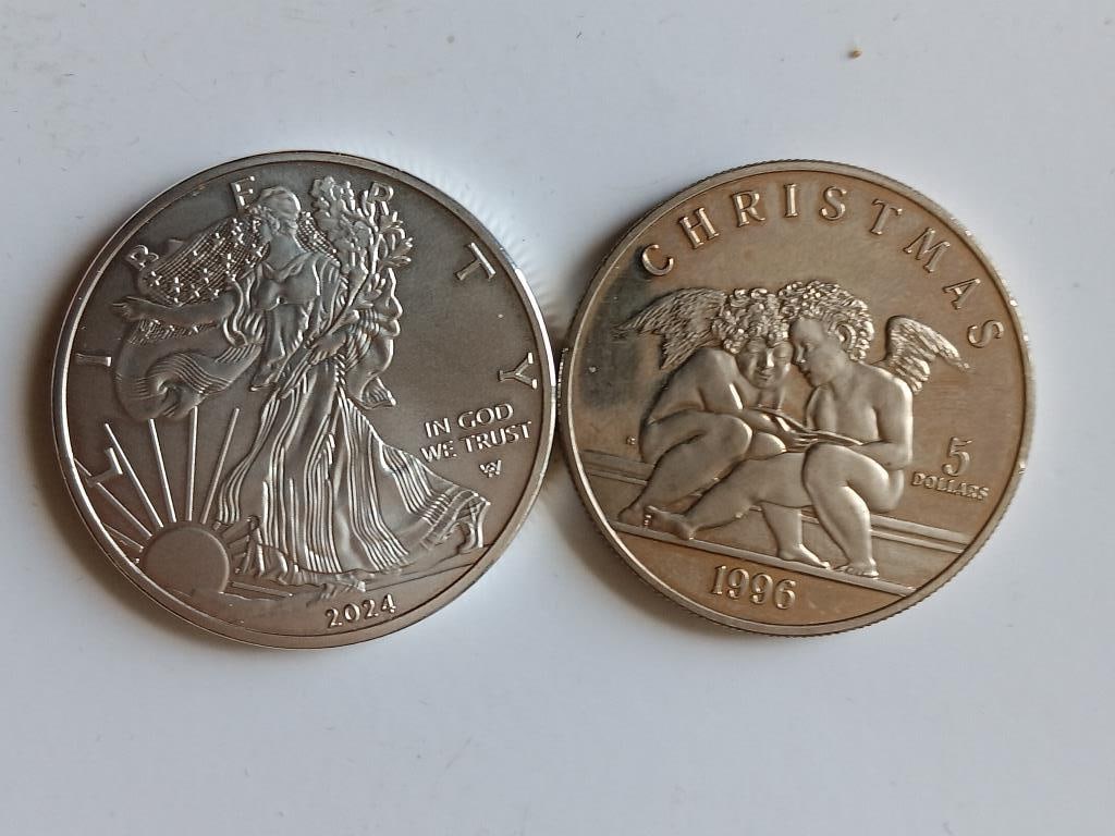 United States bullion coin and a commemorative coi: United States bullion coin and a commemorative coin from the Marshall Islands. The coin on the right is a 1996 Marshall Islands $5 Christmas commemorative coin. Part of a series issued between