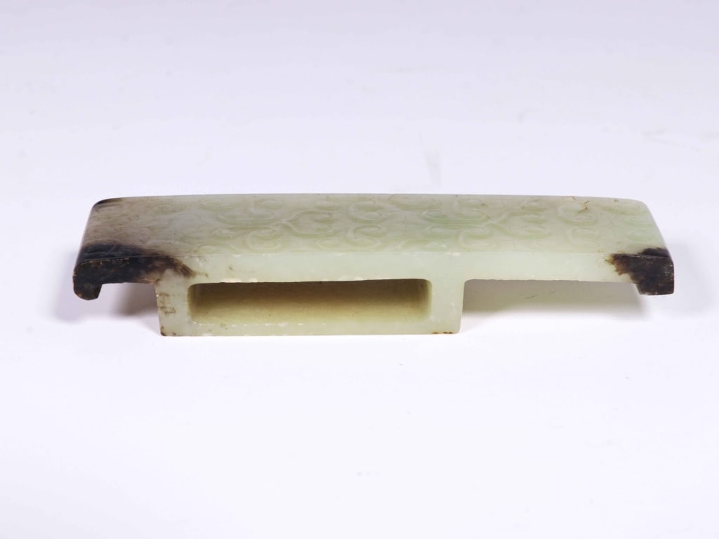 Chinese ancient Jade Scabbard slide: Dimension: 9.6cm L x 2.8cm x 1.4cm. The top surface is decorated with a grain pattern , consisting of neat, raised spiraled dots. This motif was highly prestigious in early Chinese jade work,