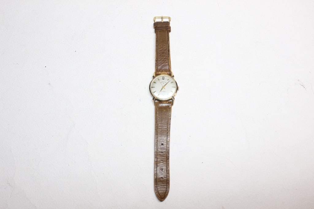 vintage Lord Elgin mechanical wristwatch: vintage Lord Elgin mechanical wristwatch, likely dating from the late 1950s to the 1960s. Lord Elgin was the premium line of the Elgin National Watch Company, known for its higher jewel counts 