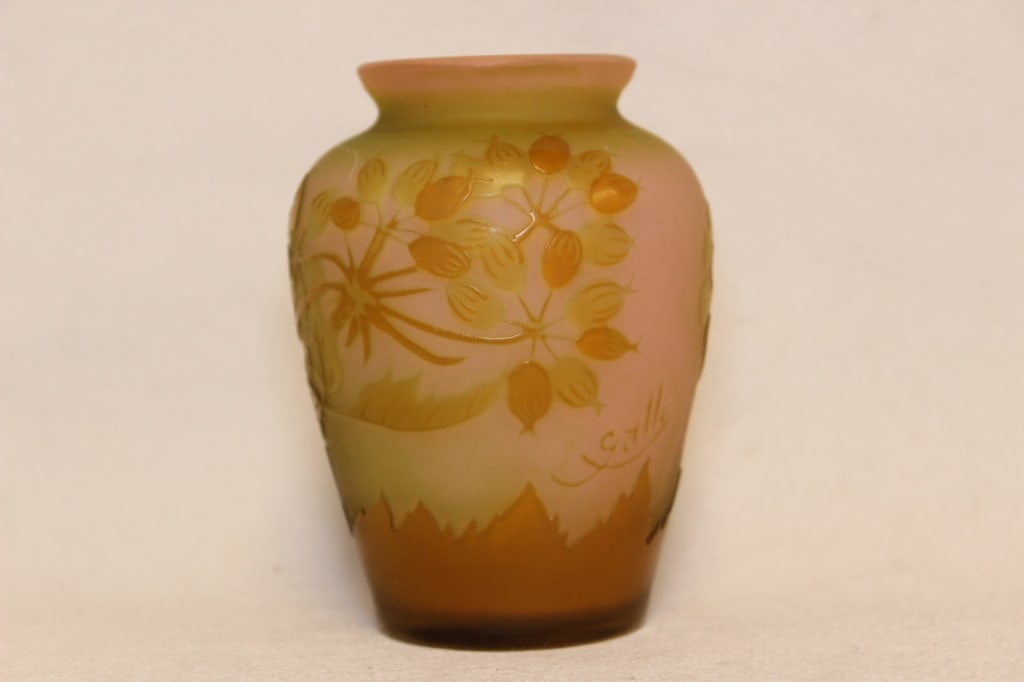 Art Nouveau Gallé cameo glass vase: Dimension: 3 1/2"H The vase is made of multi-layered glass that has been acid-etched to create a high-relief "cameo" design. This process involves selectively removing layers of colored glass to revea