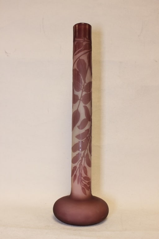 Antique Art Nouveau cameo Gallé Glass Vase: It is a "soliflore" vase, characterized by a long, slender neck and a compressed bulbous base. Dimension: 11 3/4"H. The vase features a relief decoration of wisteria (glycine) vines and foliage in