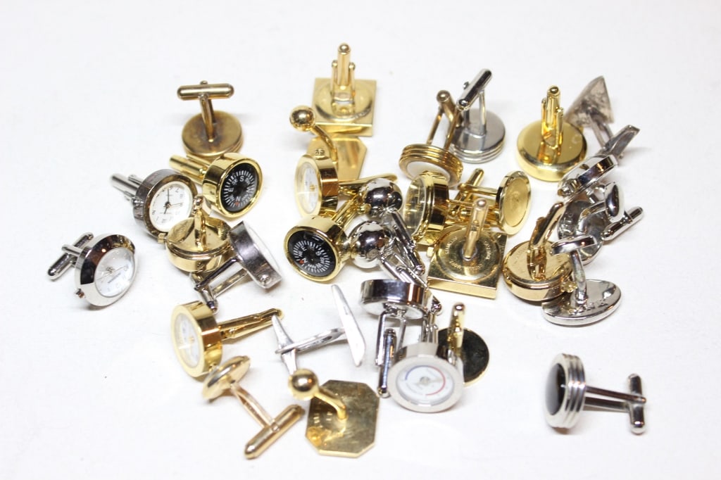 Lot of Vintage Men's Cufflinks: These pieces feature various functional and decorative elements popular in mid-20th-century men's fashion. feature working miniature compasses or watch set in gold-tone or silver-tone circular housing
