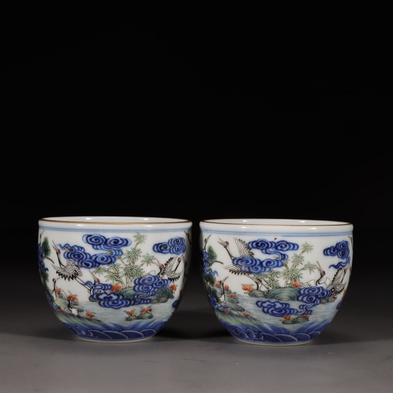 Chinese underglaze Blue and Famille-rose Cup,Mark: Chinese underglaze Blue and Famille-rose Cup,Mark. Dimension : 6.2cm H x 7.5cm W,weight is 129/126gram. The exterior walls are decorated with the traditional theme of "Cranes and Pine Trees" (Songhe