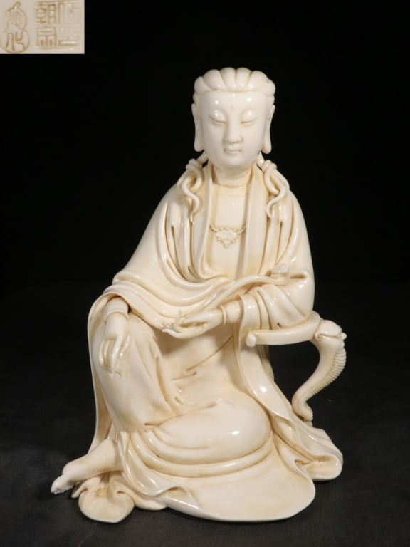 Chinese Dehua white porcelain figure of a seated G: Chinese Dehua white porcelain figure of a seated Guanyin,mark. Dimension : 32cm H x 22 x18, weight is 3380gram. Guanyin is depicted in a variant of the royal ease posture (maharajalilasana), seated