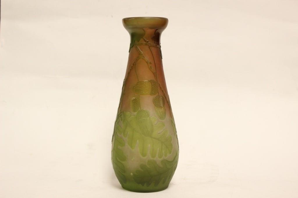 safdsa: Dimension : 8"H. It utilizes a multi-layered color scheme, featuring a frosted, translucent amber or peach ground overlaid with dense layers of olive and sage-green glass.