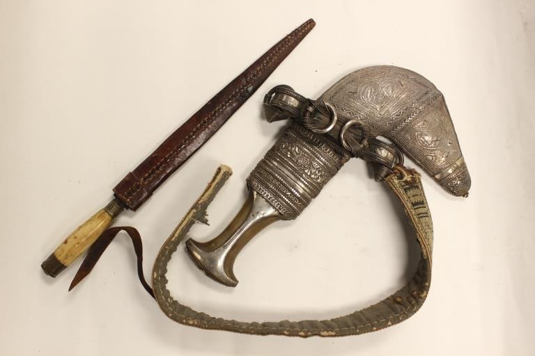 Two traditional edged weapons: Omani Jambiya / Khanjar and African Dagger with Leather Sheath Dimension : 12"L / 14 3/4"L.