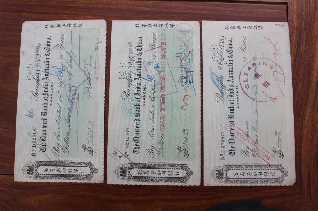 Checks,The Chartered Bank of India,Australia&China: The check is drawn from The Chartered Bank of India, Australia & China, specifically from its Shanghai branch. This British colonial bank played a massive role in international trade across Asia.