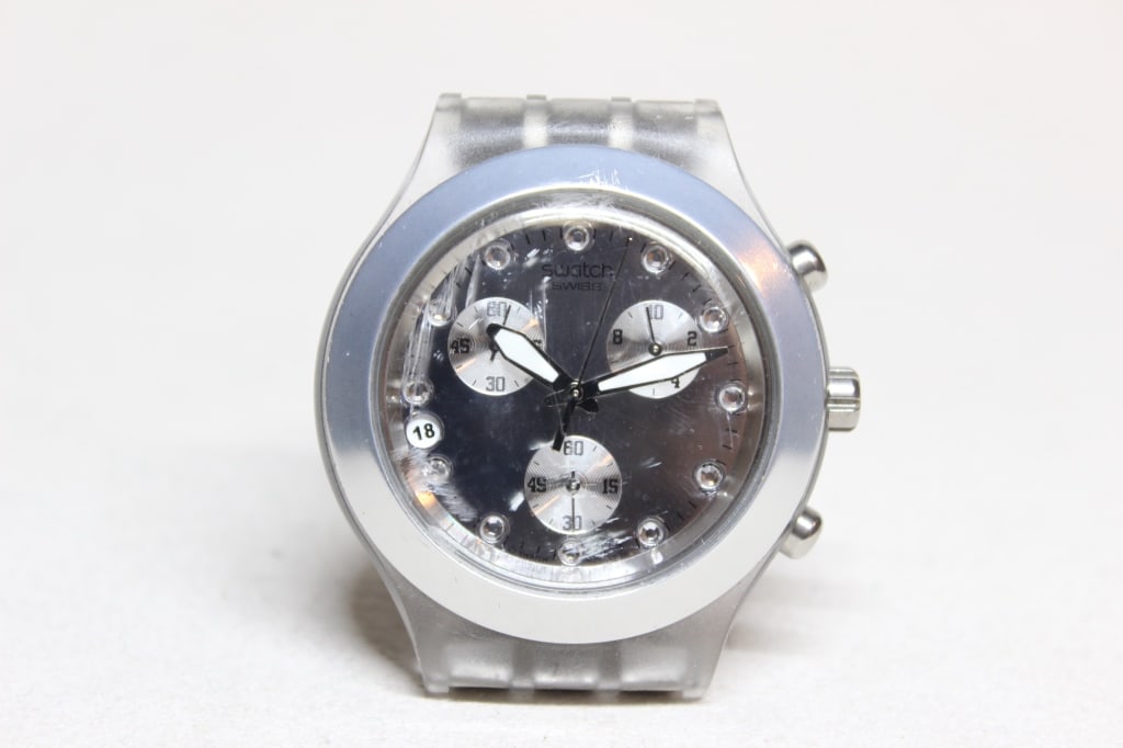 Swatch Irony Diaphane Chronograph Watch: Swatch Irony Diaphane Chronograph "Full Blooded Silver" .A 1/10th second sub-dial at 2 o'clock, a small seconds sub-dial at 6 o'clock, and a 60-minute counter at 10 o'clock.