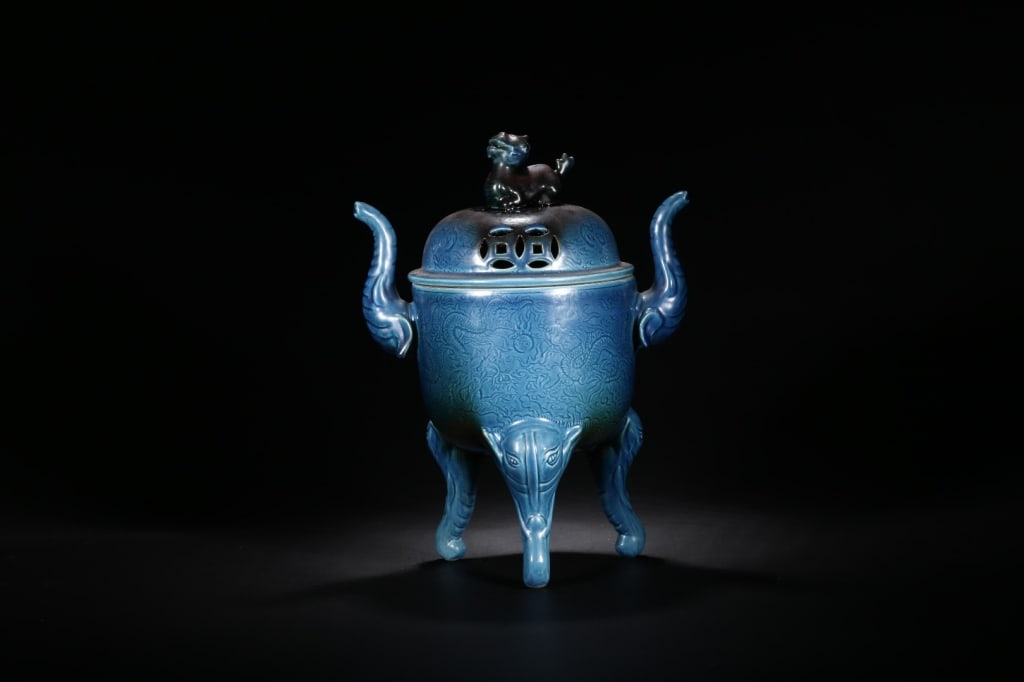 Chinese Porcelain Tripod Cover Incense Burner: Dimension : 30.3cm H x 23cm w. Chinese porcelain tripod incense burner (censer) featuring an archaic silhouette finished in a deep peacock-blue glaze.