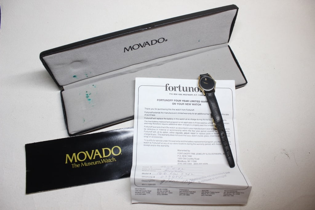 Vintage Original Movado Museum Watch: Designed in 1947 by Nathan George Horwitt, the Museum Watch is famous for its minimalist "single dot" dial, representing the sun at high noon. gold-toned (typically gold-plated) round case with a