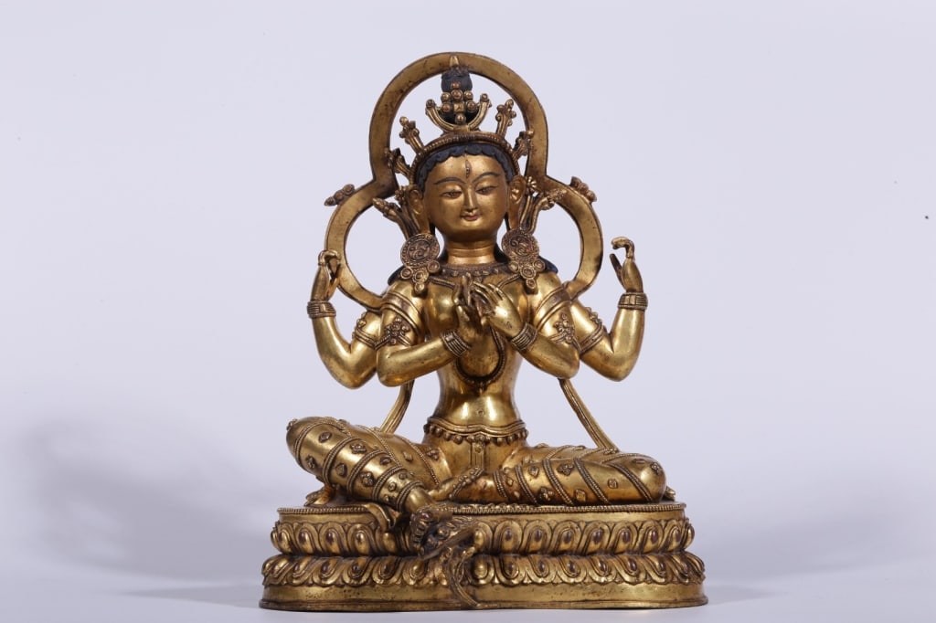 Tibetan gilt-bronze statue of the four-armed Avalo (1 of 10)