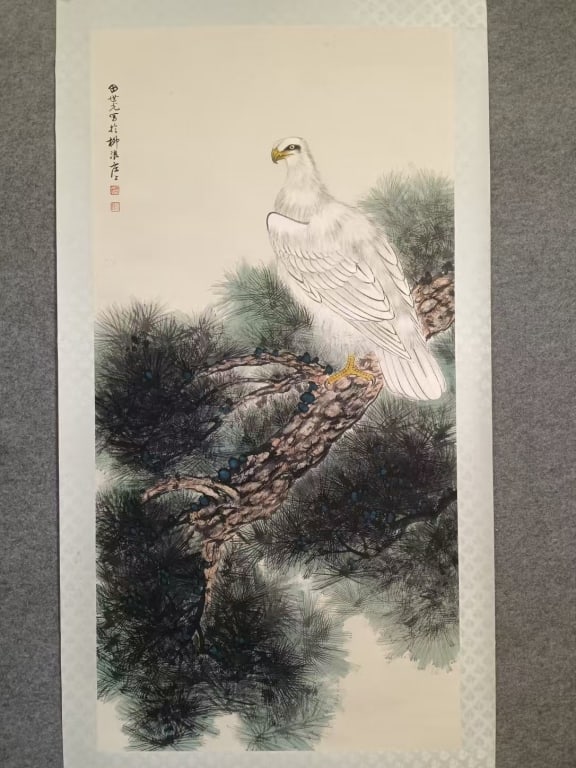 Chinese Hanging scroll Painting: Chinese hanging scroll painting depicting a White Hawk perched on an ancient Pine Tree. Dimension : 138X68cm. The vertical inscription in the upper left mimics the dedicatory or signature format seen 