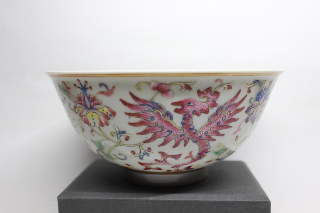Chinese Famille Rose "Phoenix" Bowl,Mark: Dimension : 6"W. The exterior of the bowl is finely enameled with an auspicious motif of phoenixes in flight (fenghuang) interspersed among scrolling peony blossoms and foliate tendrils.