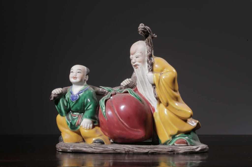 Chinese Famille Rose (fencai) porcelain Shoulao: Dimension : The Daoist deity is instantly recognizable by his signature high, elongated forehead, flowing white beard, and friendly facial expression. He wears a bright yellow robe and holds a rustic