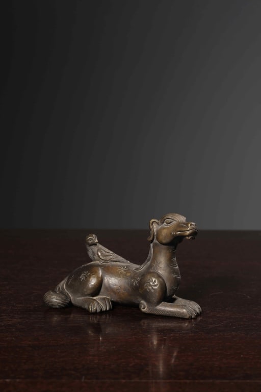 Chinese Bronze Paperweight: Chinese Bronze Paperweight or scholar's desk ornament, sculpted as a recumbent animal interacting with a bird. Dimension : 9cm L x 4x 5.5cm