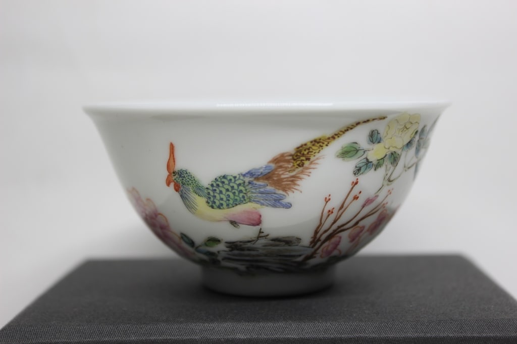 Chinese Famille Rose Porcelain Bowls,Pair: Dimension : 3 1/2"W. The imagery depicts the traditional Chinese artistic genre of "Birds and Flowers" (huaniao), symbolizing natural harmony, vitality, and prosperity.