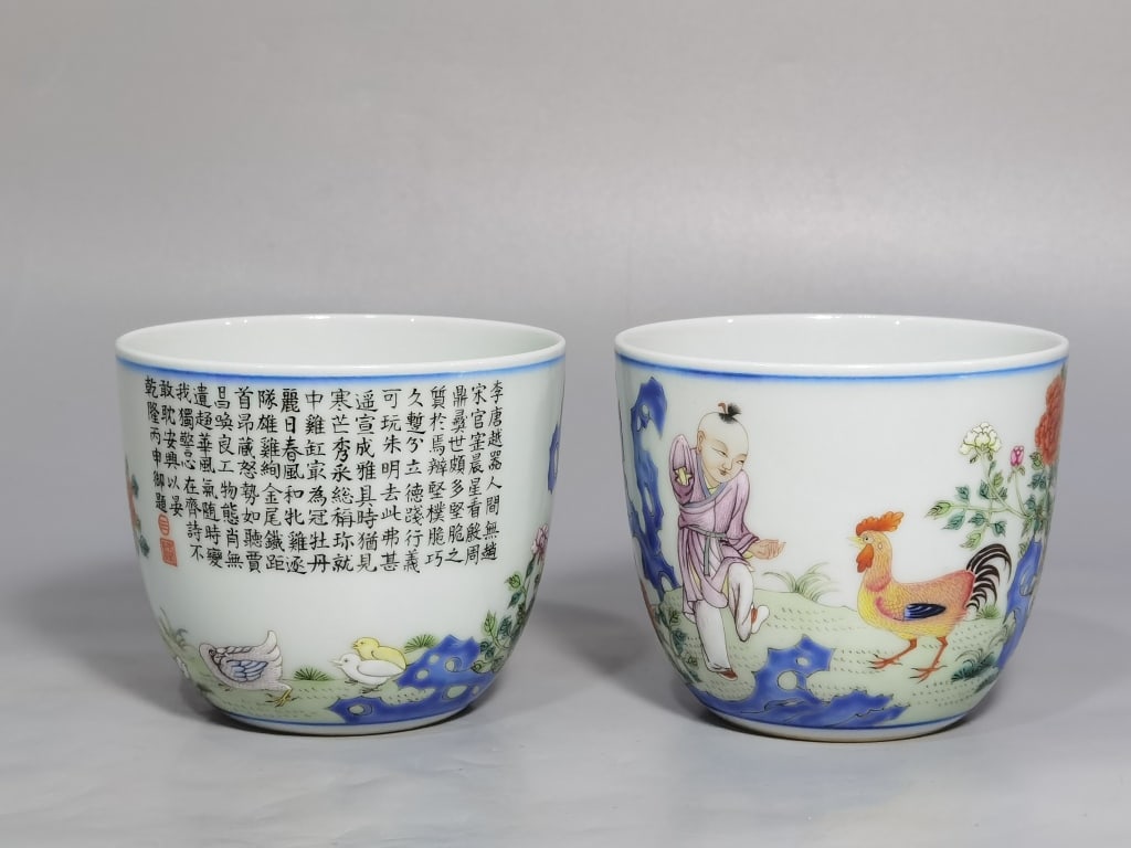 Pair of CH Famille Rose"Boy and Chicken"cups,Mark: Dimension: 7cm H x 8.2cm W The cup features a lively figural scene: a young boy dressed in traditional robes stands in a garden setting, interacting with a brightly colored rooster. The boy?s posture