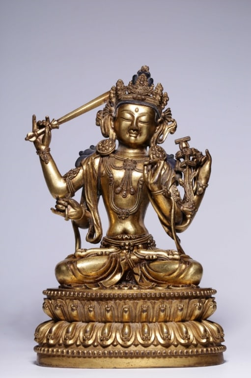 Sino-Tibetan gilt-bronze statue of the Bodhisattva: Sino-Tibetan gilt-bronze statue of the Bodhisattva Manjushri . Dimension: 24.5cm H x 15cm x 10.5cm,weight is 3182gram. Manjushri is depicted seated in the meditative
