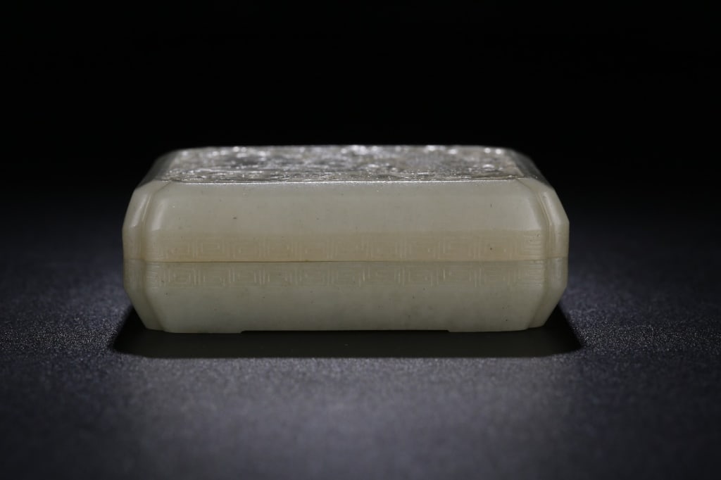 Chinese hand-carved white jade Cover Box: The top lid features a highly detailed, low-relief carving of a five-clawed Imperial Dragon (Long) weaving through stylized, swirling auspicious clouds. Dimension: 8cm L x 7.3 x 2.4cm ,weight is