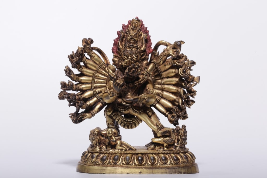 Sino-Tibetan gilt-bronze tantric statue of the wra: Sino-Tibetan gilt-bronze tantric statue of the wrathful deity Vajrabhairava. Dimension: 10.5cm H x9 x 4cm,weight is 534gram. It is cast in a heavy copper or bronze alloy and covered entirely in rich f