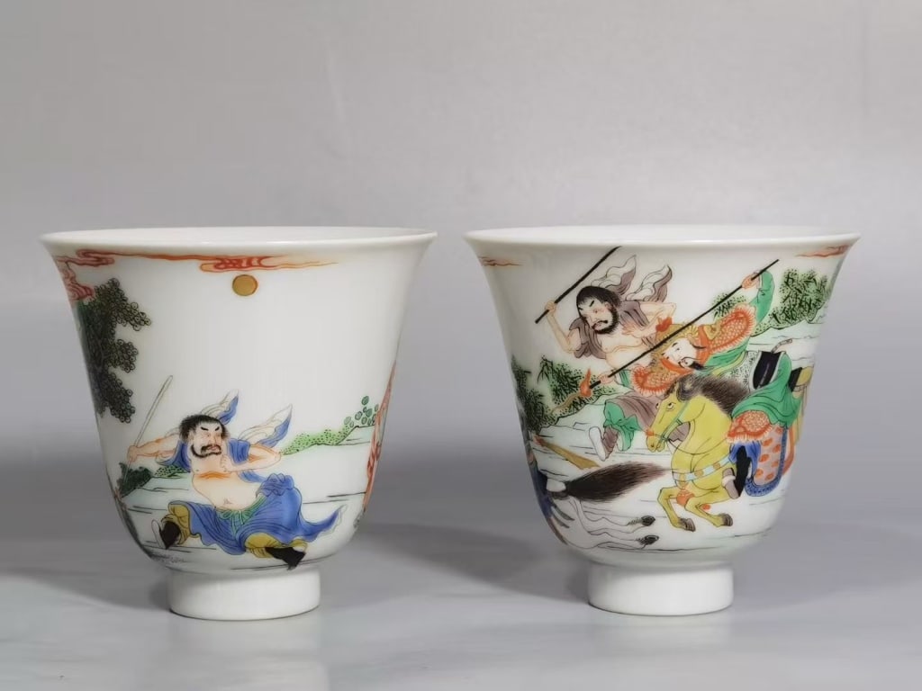 Pair of Chinese Hand-Paint Porcelain Cups ,Mark: Dimension: 7.7cm H x 8.2cm W. The exterior of the white porcelain is finely painted with polychrome enamels in the famille verte or wucai tradition, depicting a dynamic,