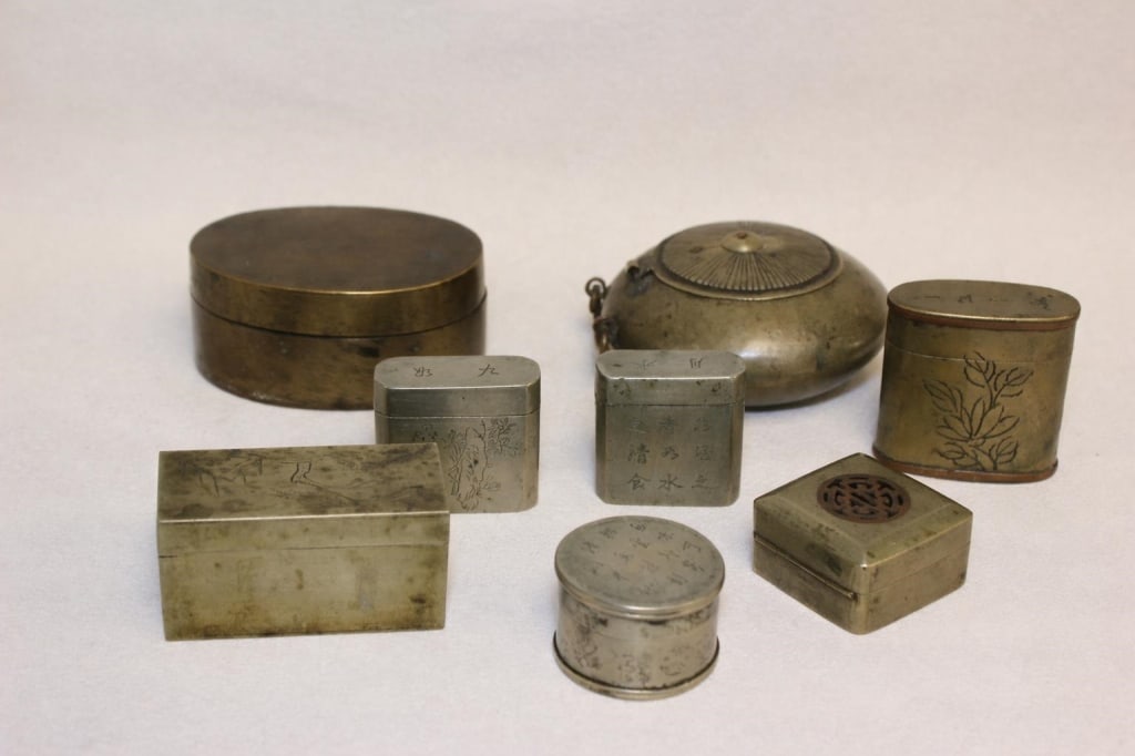 Collection of Antique Chinese Copper Boxes.: collection consists of antique Chinese scholar's objects, primarily used as ink paste boxes, seal paste containers, and tobacco or medicine canisters. Dimension: largest box is 3 " x 2 1/4".