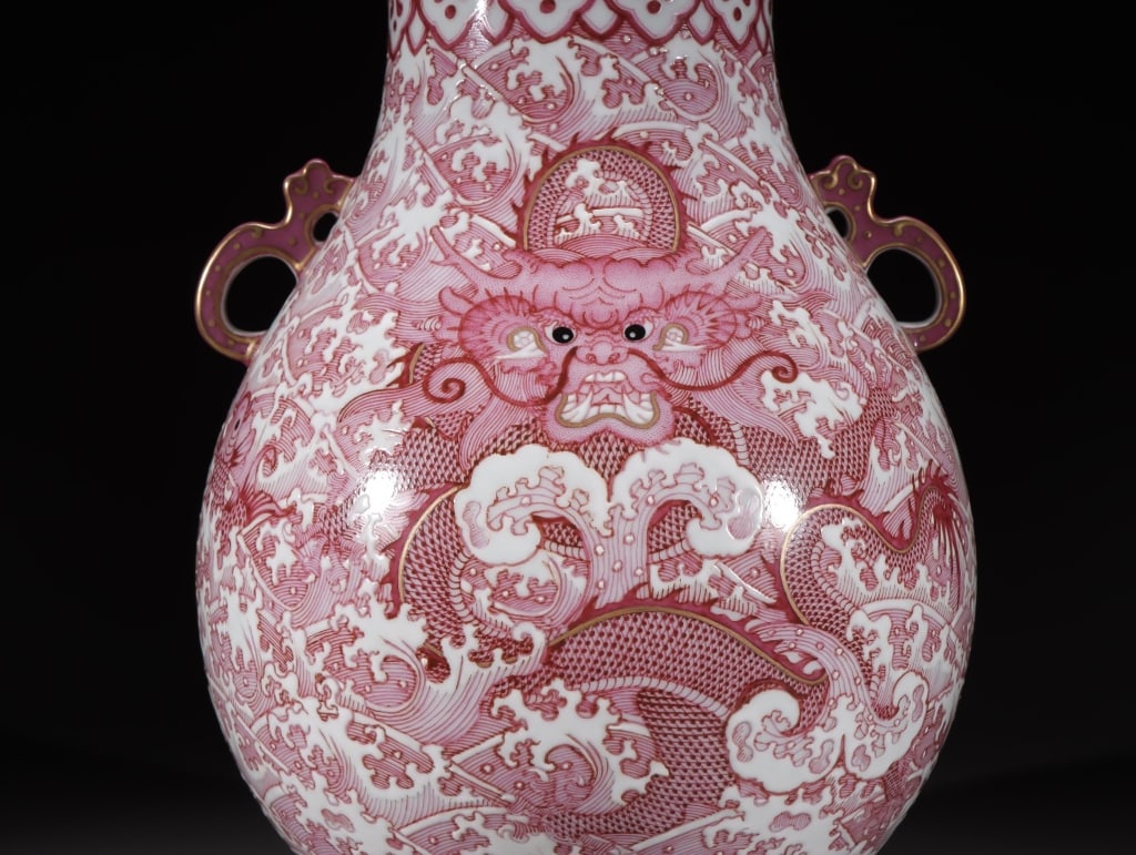 Chinese Pink-enamel underglaze-red Porcelain Vase: Chinese imperial-style pink-enamel underglaze-red "Dragon and Waves" vase.mark. Dimension: 27cm H x 21cm w. weight is 2250gram. The decoration is executed primarily in an underglaze copper-red or over
