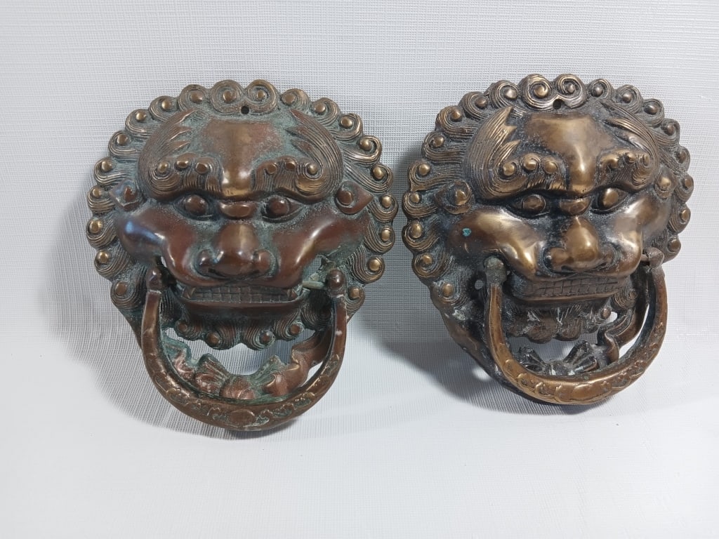 A Pair of Chinese Bronze Lion Door Knockers: A pair of Chinese bronze lion door knockers H : 15 cm X W : 14 cm