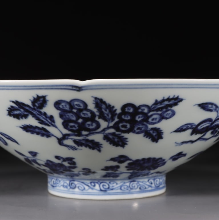 Chinese imperial-style blue and white Bowl,Mark: Dimension: 7cm H x 22.5cm w ,weight is 638gram. This perspective highlights the lobed, bracketed rim (kuikou) resembling the gentle curves of a blooming mallow flower. The inner walls slope steeply in