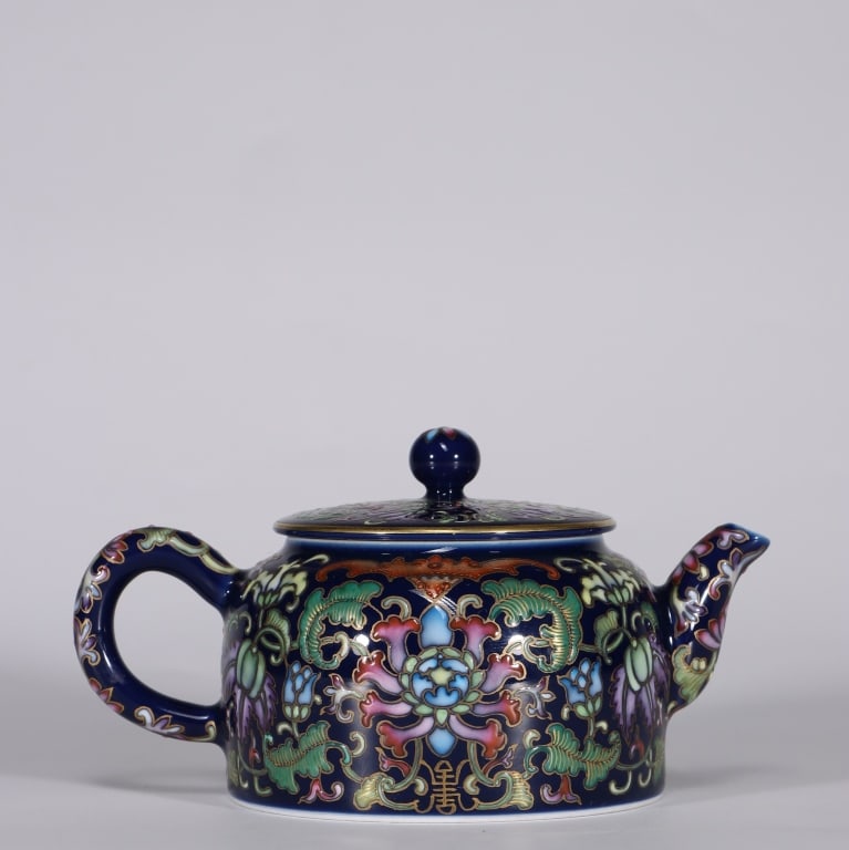 Chinese Enamel on Porcelain Teapot,Mark: Dimension: 7.2cm H x 8.5 cm W ,weight is 191gram. The intricate floral motifs are outlined with precise metal wires or fine hand-painted lines, creating stylized compartments filled with colorful