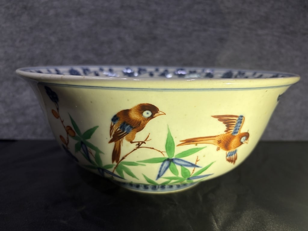 Chinese hand-painted famille rose Bowl,mark: Chinese hand-painted famille rose Bowl,mark Dimension: 28cm w x 11.6cm H. The central design features a classic Chinese "birds and flowers" (huaniao) theme. It depicts two detailed brown songbirds?one