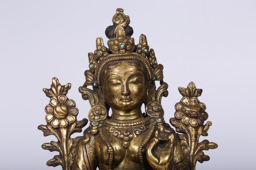 Chinese gilt bronze statue of Green Tara: Dimension: 18cm H x 12.5cm L x 9.7cm W,weight is 1178gram. She is seated in lalitasana (royal ease) on a double-lotus pedestal. Her right leg extends downward, with her foot supported by a small lotus
