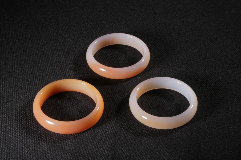 Three Chinese Agate Carved Bangles.: Dimension: 7.6cm w /7.3cm w /7.3cm w.