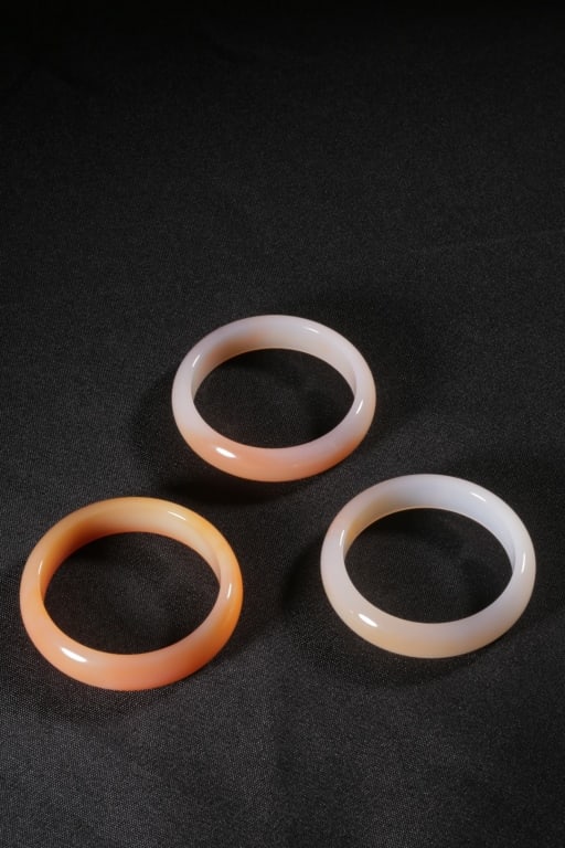 Three Chinese Agate Carved Bangles. - 2