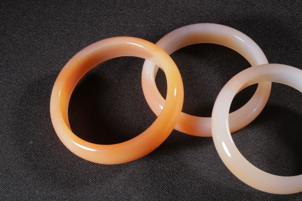 Three Chinese Agate Carved Bangles. - 9